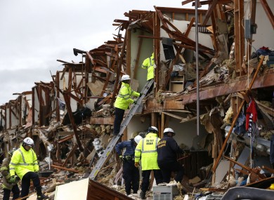 Firefighters conduct search and rescue of an apartment destroyed by an explosion at a fertilizer plant in West, Texas.