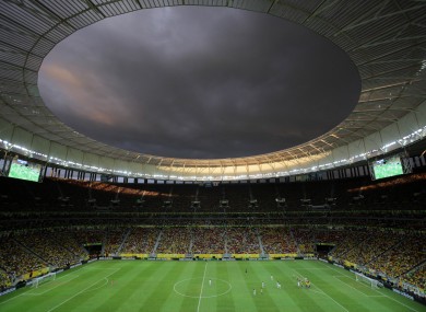 Clouds loom over the National Stadium during the Group A Confederations Cup opening match between Brazil and Japan, in Brasilia.