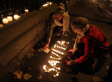 Candles are left in tribute outside Leinster House in Dublin, after thousands of people marched demanding legislation on abortion after the death of Indian woman Savita Halappanavar last year.