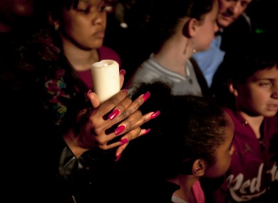 A woman in Pretoria prays for former South African President, Nelson Mandela.