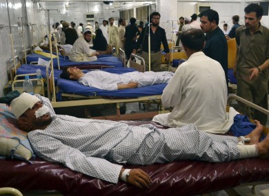 Injured victims of Friday's bombing at a busy market, is treated at Lady Reading Hospital in Peshawar, Pakistan, Saturday, July 27, 2013.