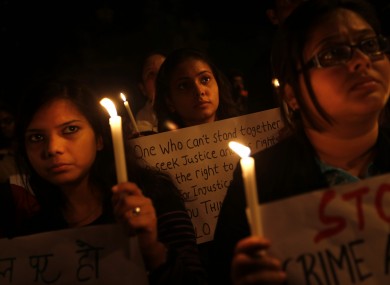 Indian students participate in a candlelight vigil to mark the passing the 23-year-old student who was gang-rape on a bus in New Delhi, India.