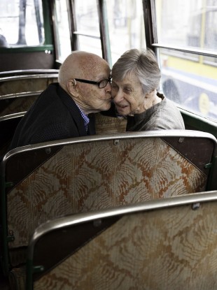 Bill Short steals a kiss from wife Norrie on a vintage CIE Tour bus.