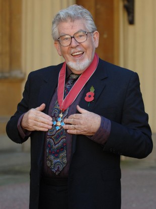 Rolf Harris with his CBE medal in 2006.