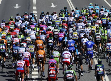 The pack rides outside Monforte de Lemos during the fifth stage of the Vuelta.