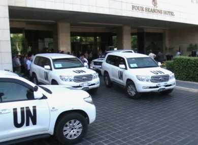UN vehicles at a hotel after UN weapons inspectors arrive in Damascus.