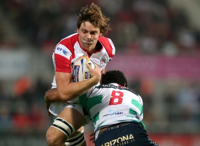 Ulster's Iain Henderson is tackled by Manoa Vosawai of Benetton Treviso.