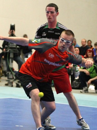 Robbie McCarthy shoots left-handed against former Clare underage hurler Diarmuid Nash.
