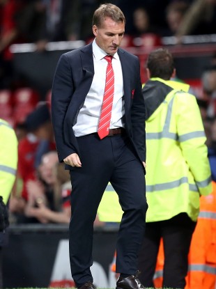 Liverpool manager Brendan Rodgers leaves the pitch last night.