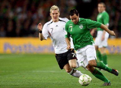 Bastian Schweinsteiger of Germany with Andy Reid of Ireland in 2007.