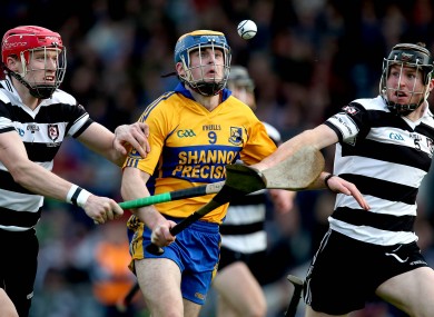 Midleton's Seamus O'Farrell and James Nagle with Seadhna Morey of Sixmilebridge.