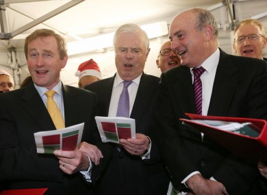 Enda Kenny, Peter Mathews and Senator Paddy Burke in full song in carol singing outside Leinster House this week