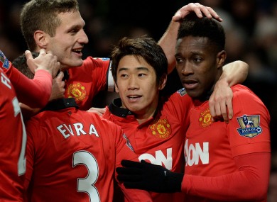 Manchester United's Danny Welbeck (right) celebrates with Shinji Kagawa and Nemanja Vidic.