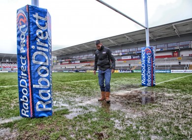 Referee Leighton Hodges looks at the mud.