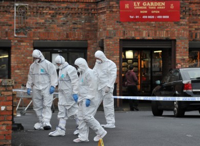 Investigators at the scene of the shooting last year.