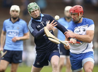 Dublin goalkeeper Gary Maguire is challenged by Waterford's Seamus Prendergast.