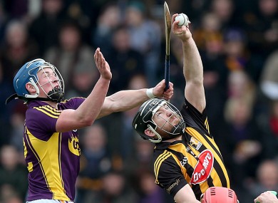 Wexford's Ian Byrne with Richie Hogan of Kilkenny.
