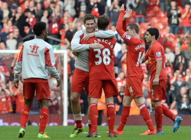 Liverpool's Steven Gerrard celebrates with Jon Flanagan after his team's 4-0 win.