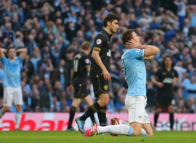 Manchester City's Edin Dzeko reacts after a missed chance.
