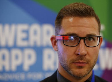 An exhibitor demonstrates Google Glass at the Wearable Technology Show held at Kensington Olympia, London.