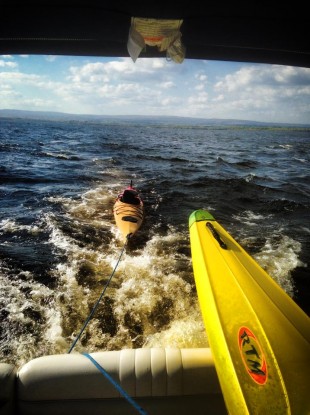 The kayak is towed back to the marina