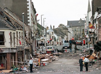 Police officers stand on Market Street, the scene of a car bombing, in the centre of Omagh.