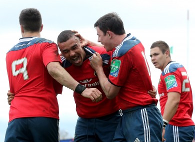 Munster players Felix Jones and Simon Zebo celebrate a try against Toulouse.