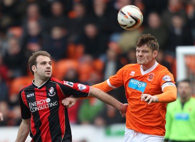 Pittman, left (pictured here against Blackpool), cleared off the line for Bournemouth.