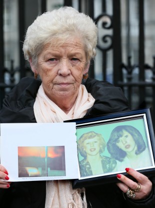 Christine Keegan holds a picture of the daughters she lost in the Stardust fire.