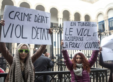 Tunisian women demonstrate outside a Tunis courthouse