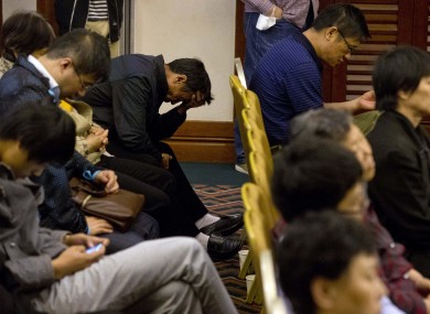 Relatives of Chinese passengers onboard the missing Malaysia Airlines MH370 plane listen to a briefing by members of the team tasked with searching for the plane at a hotel in Beijing, China.