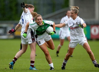 Mairead Coyne and Sinead Burke with Fiona Leavy battle for possession.