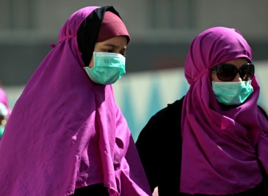 Muslim pilgrims wear surgical masks to prevent infection from respiratory virus known as the Middle East respiratory syndrome (MERS) in the holy city of Mecca, Saudi Arabia.