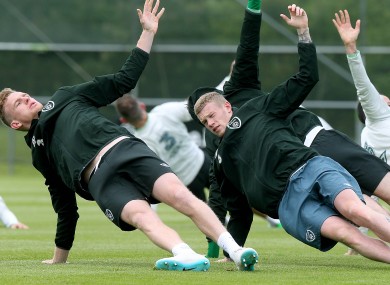 Alex Pearce and James McClean stretch in Malahide. David Meyler (calf) remains the only injury worry ahead of Sunday's game.