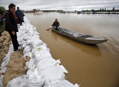 A man navigates his boat by the bank of the Sava river in Sremska Mitrovica, 90km west of Belgrade.