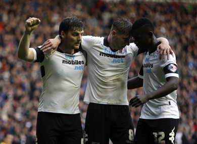 Jeff Hendrick celebrates with team-mates Chris Martin (left) and Simon Dawkins.