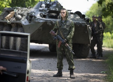 Ukrainian government soldiers guard a checkpoint near Kramatorsk, eastern Ukraine.