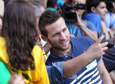 France's Yohan Cabaye poses with fans ahead of a press conference at the Teatro Pedro II in Ribeirao Preto, Brazil.