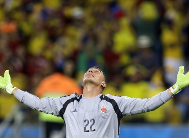 Faryd Mondragon celebrates after Colombia's James Rodriguez scored his side's fourth goal.
