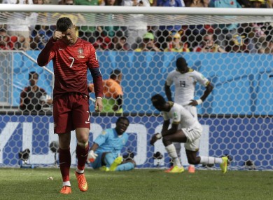 Cristiano Ronaldo ambles back to the halfway line after scoring Portugal's second goal.
