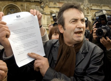 Gerry Conlon outside the House of Commons with the letter of apology he received from Prime Minister Tony Blair in 2005.