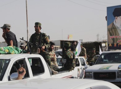 Iraqi Shiite fighters deploy with their weapons in Basra, Iraq's second-largest city, 340 miles (550 kilometers) southeast of Baghdad.
