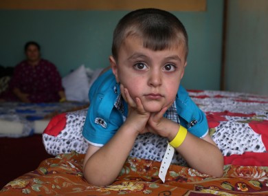 An Iraqi Christian displaced boy who fled from the Christian village of Hamdania