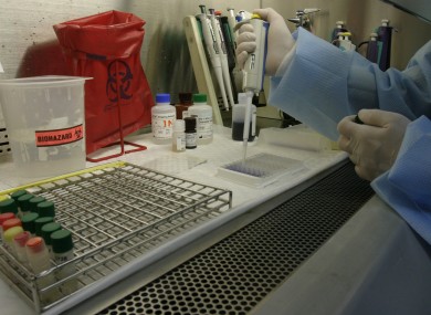 A technician works on blood samples