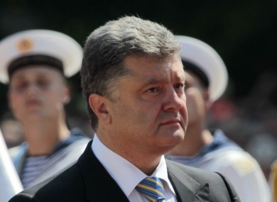 Ukrainian President Petro Poroshenko reviews an honor guard after the inauguration ceremony in Sophia Square in Kiev.