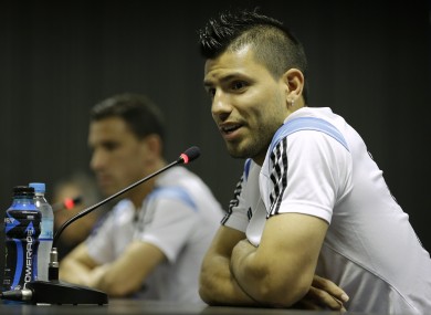 Argentina's Sergio Aguero, right, speaks during a news conference next to teammate Maxi Rodriguez.