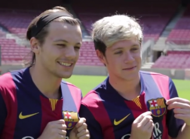 Louis and Niall show the Barca badge some love.