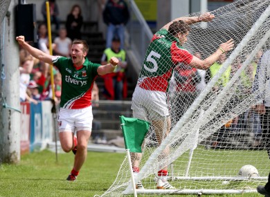 Lee Keegan hits the back of the net after scoring a goal as Cillian O'Connor celebrates setting him up.