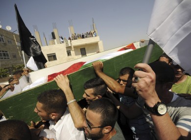 Palestinians carry the body of 16-year-old Mohammed Abu Khdeir in Jerusalem