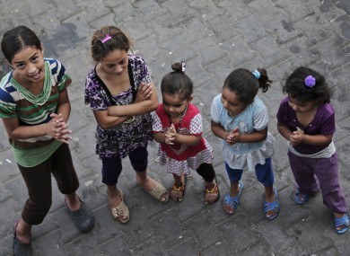 Displaced Palestinian children participate in a play session at a U.N. school where they had sought refuge along with their families during the war, in Gaza City.